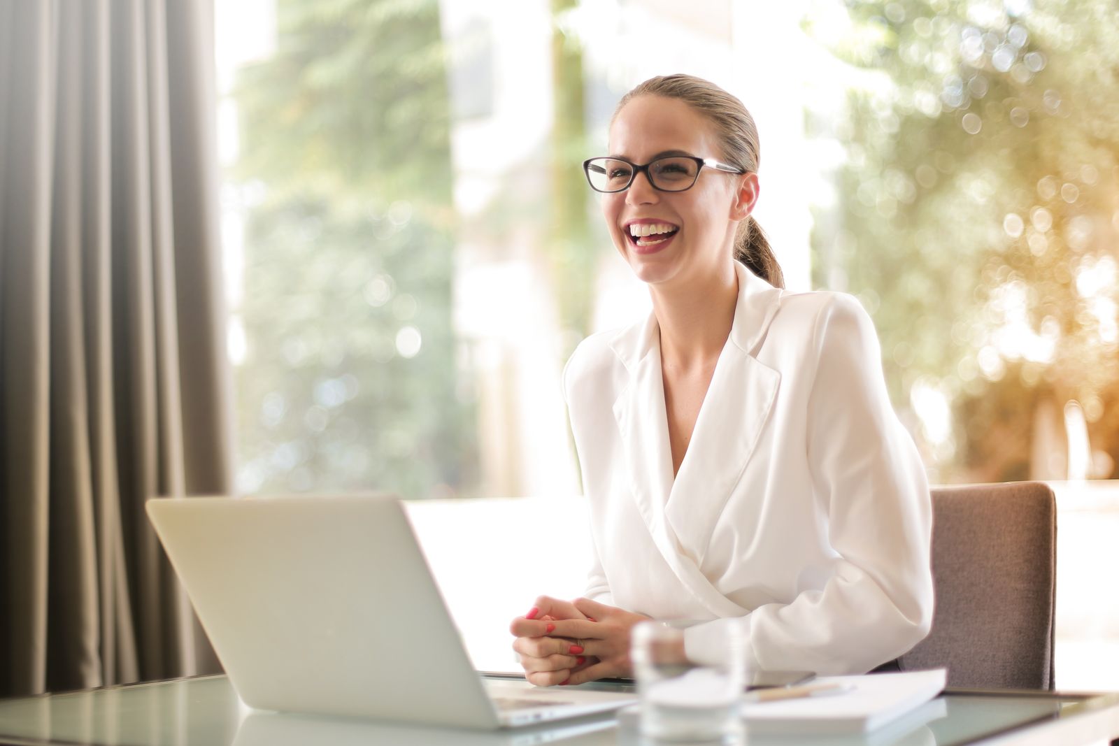 Consultant working on a laptop, digitizing their practice with AI-powered lead capture